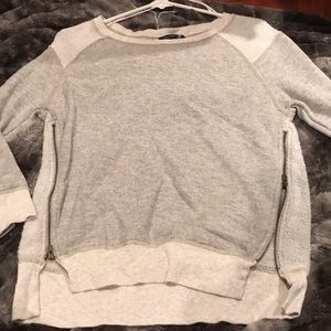 Gray top with zipper detailing on both sides